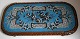 Tray of carved 
wood, 19th 
century. Edge 
with tracks 
like leaves. 
Plate adorned 
with beadwork 
...