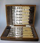 English fish 
cutlery, 12 
parts, 6 knives 
and forks 6. 
19th century. 
Grips of 
plastic. In 
wooden ...