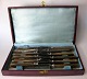 A box of 12 
knives with 
bone handles. 
Blades of iron. 
With maker's 
mark. Probably 
Germany, 19th 
...