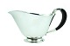 Georg Jensen 
silver. Jørgen 
Jensen for 
Georg Jensen; a 
sterling silver 
sauce boat with 
ebony ...