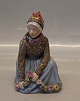 Kongelig Dansk Egnsfigur 12413 Kgl. Pige med blomster fra Fanø 14 cm Overglasur 
Carl Martin-Hansen (1877-1941)