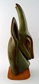 Very large Rörstrand / Rorstrand Art deco stoneware figure by Gunnar Nylund, 
Gazelle on stand in wood.