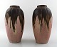 Gilbert Metenier, French ceramist. A pair of Art Deco pottery vases in flaming 
glaze.