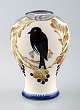 Aluminia faience vase, bird motif.
Measures 18 x 13 cm.