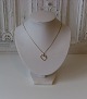 Asymmetric gold 
heart with 
brilliant of 
0.01 ct. 
Stamped 585 
and master 
stamp.
Measures 1.7 x 
...