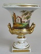 Vase of 
porcelain, 19th 
century. 
Classical form 
with square 
feet and two 
handles. With 
gilding. ...