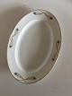 Royal 
Copenhagen No 
118 Oval 
Serving Dish w. 
Golden Peacock 
Feather 
Ornament. 39.5 
cm (15 ...