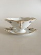 Royal 
Copenhagen No 
118 Sauceboat 
with Handles w. 
Golden Peacock 
Feather 
Ornament. 10 cm 
H (3 ...