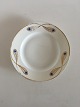Royal 
Copenhagen No 
118 Side Dish 
w. Golden 
Peacock Feather 
Ornament. 15 cm 
dia (5 29/32"). 
In ...