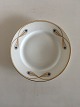 Royal 
Copenhagen No 
118 Dinner 
Plate w. Golden 
Peacock Feather 
Ornament. In 
whole 
condition, the 
...