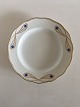 Royal 
Copenhagen No 
118 Dinner 
Plate w. Golden 
Peacock 
Ornament. 24.5 
cm (9 41/64"). 
In nice ...