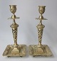 Pair of brass 
candlesticks, 
19th century. 
With pierced 
strain. 
Decorated with 
flowers. Square 
...