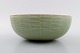 Axel Salto: A Royal Copenhagen stoneware bowl decorated with fluted pattern with 
celadon glaze.