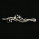 Georg Jensen. 
Sterling Silver 
Grapes Brooch 
#275
Designed by 
Georg Jensen 
1866 - 1935.
Stamped ...