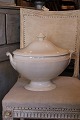 Large fine oval old French cream colored faience terrin.