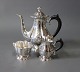 Coffee serving 
set consisting 
of coffee jug, 
cream jug and 
sugar bowl in 
835 silver and 
stamped ...
