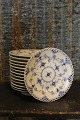 Old Blue 
fluted, full 
lace flat 
dessert plate 
from Royal 
Copenhagen. 
Dia.:15cm. 
Decoration ...