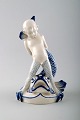 Rare Rörstrand 
porcelain 
figure, sea boy 
and fish. 
Measures 19 
cm. X 11 cm. 
1. factory ...