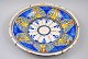 Faience dish, 
polychrome 
decorated. 18th 
century 
Probably 
Portugal. Dia.: 
34 cm.
Excellent ...