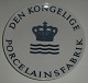 Royal 
Copenhagen 
Dealer sign:  
Den Kongelige 
Porcelainsfabrik 
Commercial 
Plate ca 26 cm  
In mint ...
