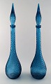 A pair of very tall turquoise decanters. Venini style. 1960 / 70s.
