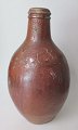 Greybeard. 
Germany, 17th 
century. Brown 
glazed. Stamped 
with foliage 
and star. 
Height: 29 ...