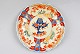 Japanese dish. 
Imari. 19th 
century. 
Polycrom 
decoration with 
flowers. Dia: 
22 cm.