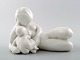 Sjælden Bing & Grøndahl/ B&G, blanc de chine porcelænsfigur af ung nøgen kvinde 
med barn og fisk af Kai Nielsen.