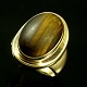Georg Jensen. 
18k Gold Ring 
with Tiger's 
Eye #1046A.
Designed by 
Harald Nielsen 
1892 - ...