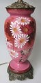 English table 
lamp, 19th 
century. Pink 
glass (Topaz 
glass) with 
enamel 
decorations of 
flowers. ...