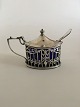 Birks Mustard 
pot in sterling 
silver with 
spoon in 
silverplate.
Blue Glass 
insert
Measures ...