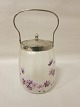 Biscuit-box made of glass with a lid of metal, antique
About 1900.
H: 26cm incl. the handle.