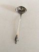 Georg Jensen 
Akkeleje 
Sterling Silver 
Cream Ladle No 
125. Measures 
12.5 cm / 4 
59/64 in.