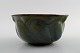 Early Axel Salto for Royal Copenhagen: Stoneware bowl, modeled in organic form, 
decorated with glaze in blue-green tones. 1930s.