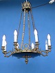 Brass lamp with 
8 candleliere. 
H 90 cm. W 64 
cm.. From ca. 
1910-1920. Fine 
condition