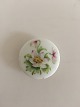 Royal 
Copenhagen 
Porcelain 
Button with 
Handpainted 
Flower Motif. 3 
cm dia.