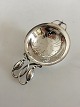 Georg Jensen 
Sterling Silver 
"Blossom" Tea 
Strainer No. 
84. 11.5 cm L. 
7 cm dia. 
Weighs 53 ...