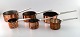 Henning Koppel for Georg Jensen: "Taverna". Six pots in copper, inner sides 
coated with silver. Handles in steel.
