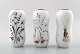 STIG LINDBERG, tre vaser, "Grazia", hvidglaseret, malet med sølv dekoration i 
form af blomster, Gustavsberg, Sverige.