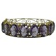 Gilted silver 
jewellery. 
A bangle of 
gilted silver 
set with oval 
amethyst. 
Jewellery 
around ...