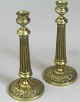 Couple of 
french candlesticks 
in brass, 
empire, 1820.
Base with 
decorations in 
the form of ...