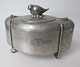 Art deco box in 
pewter, 1929, 
Denmark. 
Decoration with 
bird and 
flowers on the 
lid. Stamped: M 
...