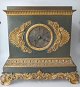 French empire 
bronze mantel 
clock, approx. 
1820. In green 
patinated 
bronze, 
decorated with 
...