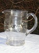 Glass jug. 
Height 17 cm. 
Fine condition