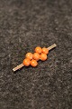 14 karat gold 
brooch with 
corals.
Measures: 
5x1,5cm.