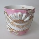 English beard 
cup in 
porcelain, 
approx. 1900. 
Decorated with 
light red and 
gilding. With 
text on ...