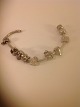 Pandora 
Bracelet
Sterling 
silver 925s
With 6 charms:
Marehunter, 
calculator, 
horse, river 
...