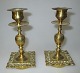 Pair of French 
brass 
candelliers, 
19th century. 
Profiled stem 
and square foot 
with rococo ...