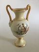 Bing & Grøndahl 
Early vase with 
overglaze 
decoration and 
Roman/Greek 
bisque heads.
Measures ...