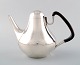 Georg Jensen, number 1017. Coffee pot with handles of Guaiacum Wood.
Weight 670 grams.
Henning Koppel (1918-1981) year 1952.